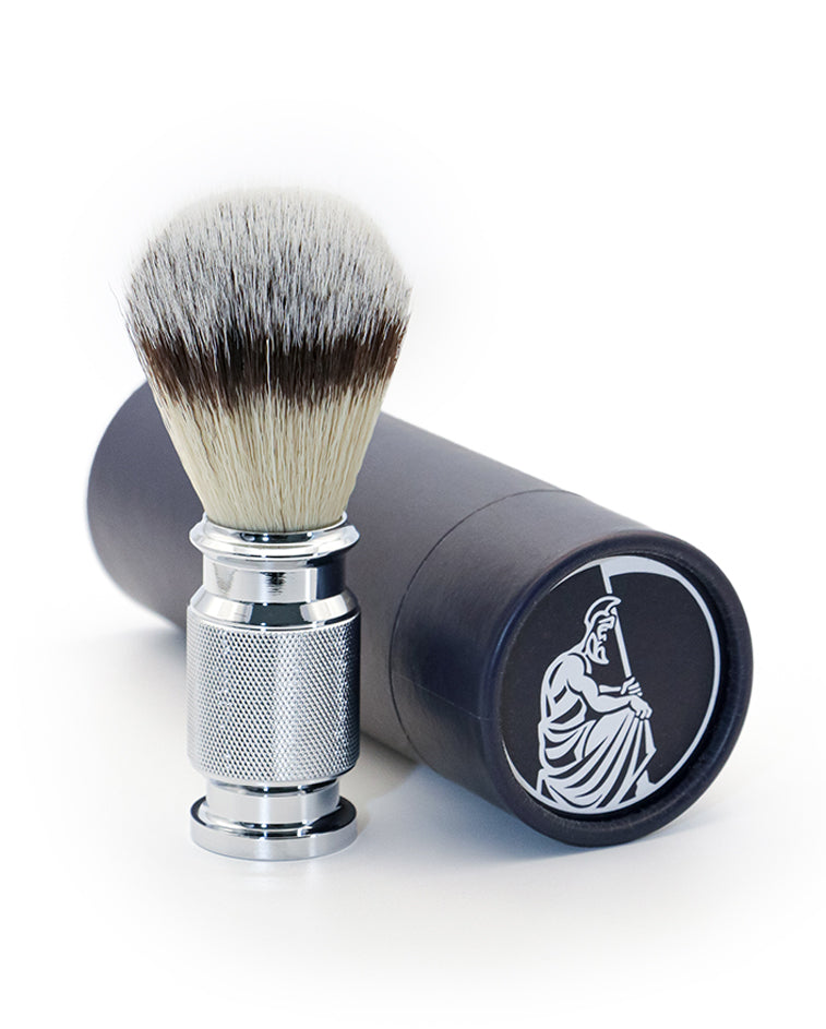 A Kronos shaving brush in synthetic fibre, the tool used to build a traditional wet-shaving lather.