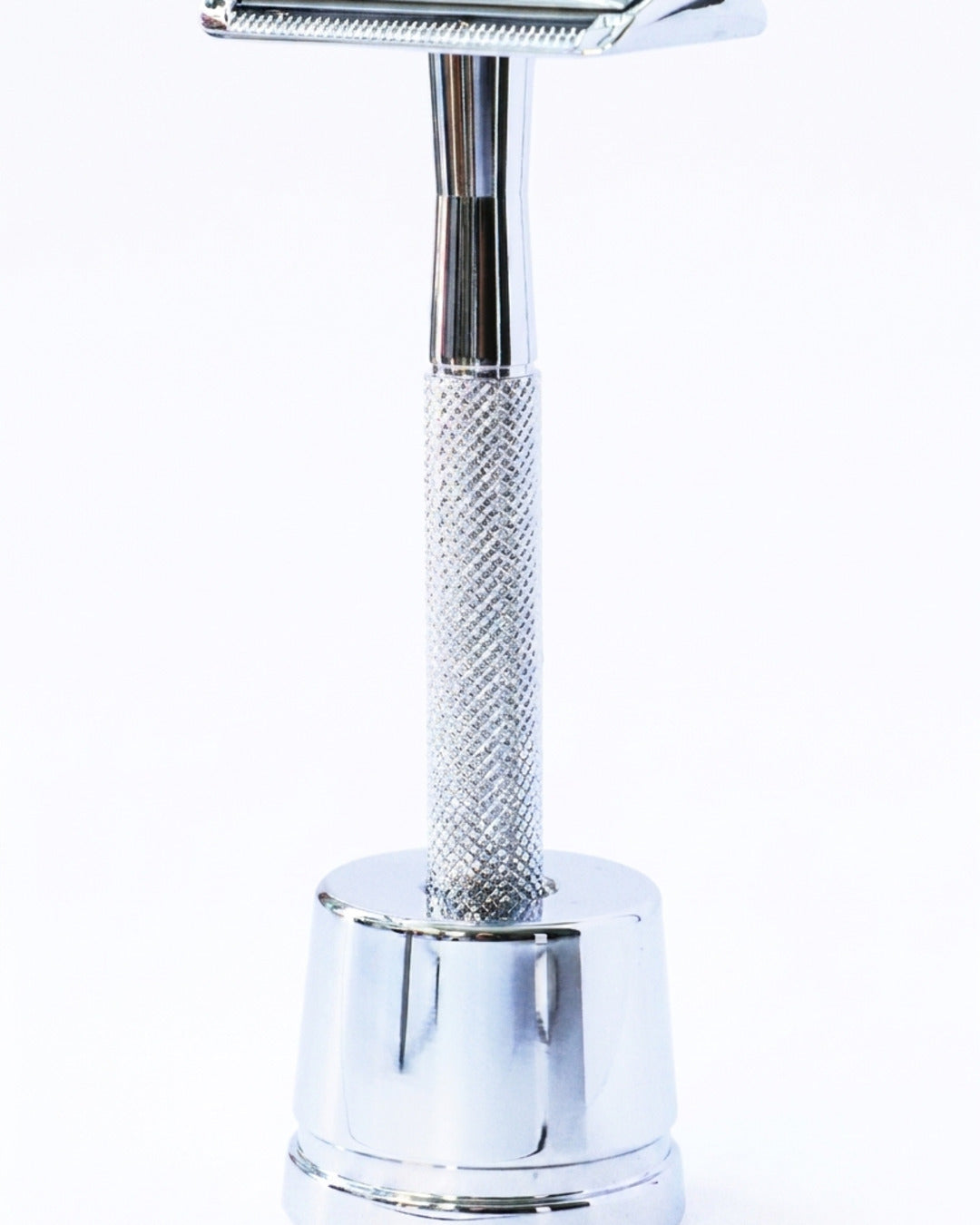 Kronos chrome safety razor upright on its stand