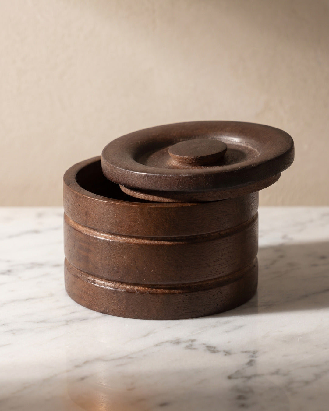 Kronos wooden shaving bowl on marble, studio still