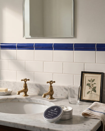 Kronos sandalwood shaving cream, styled in a bathroom