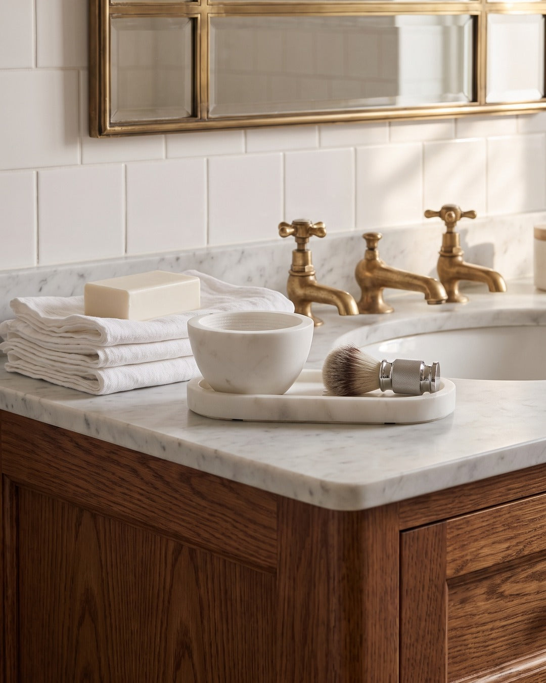 Kronos marble storage tray holding the shaving brush and razor beside a marble bowl