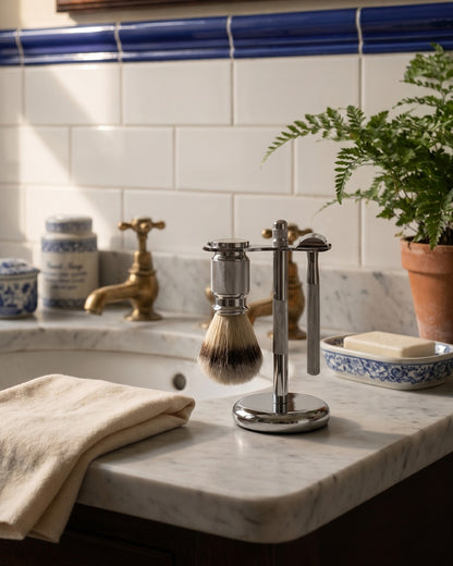 The Kronos Marble Suite Set in chrome: safety razor on its stand with the shaving brush