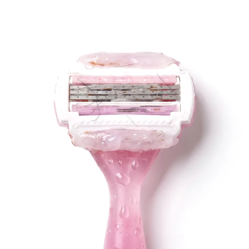 A pink cartridge razor with its moisture strip melted over the head
