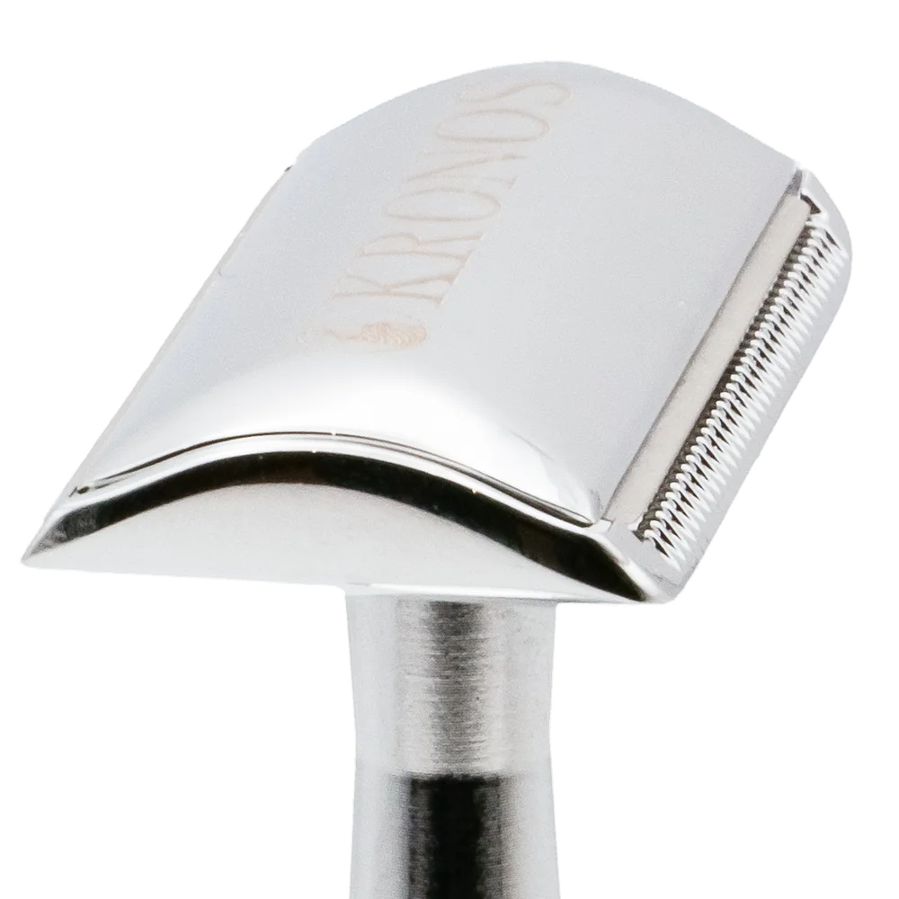 The Kronos razor head laid over it; the blade's end sits inside the head