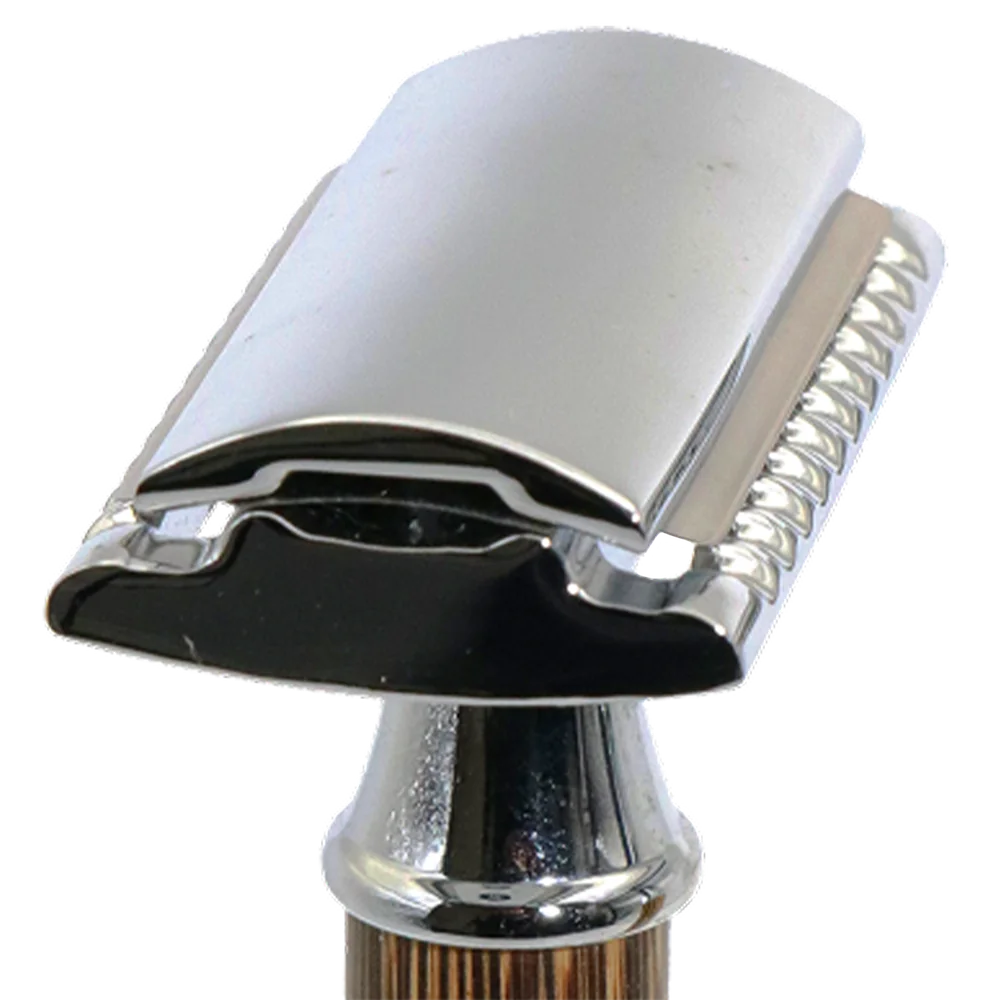 A typical safety razor head; the blade's corner stands clear of the cap